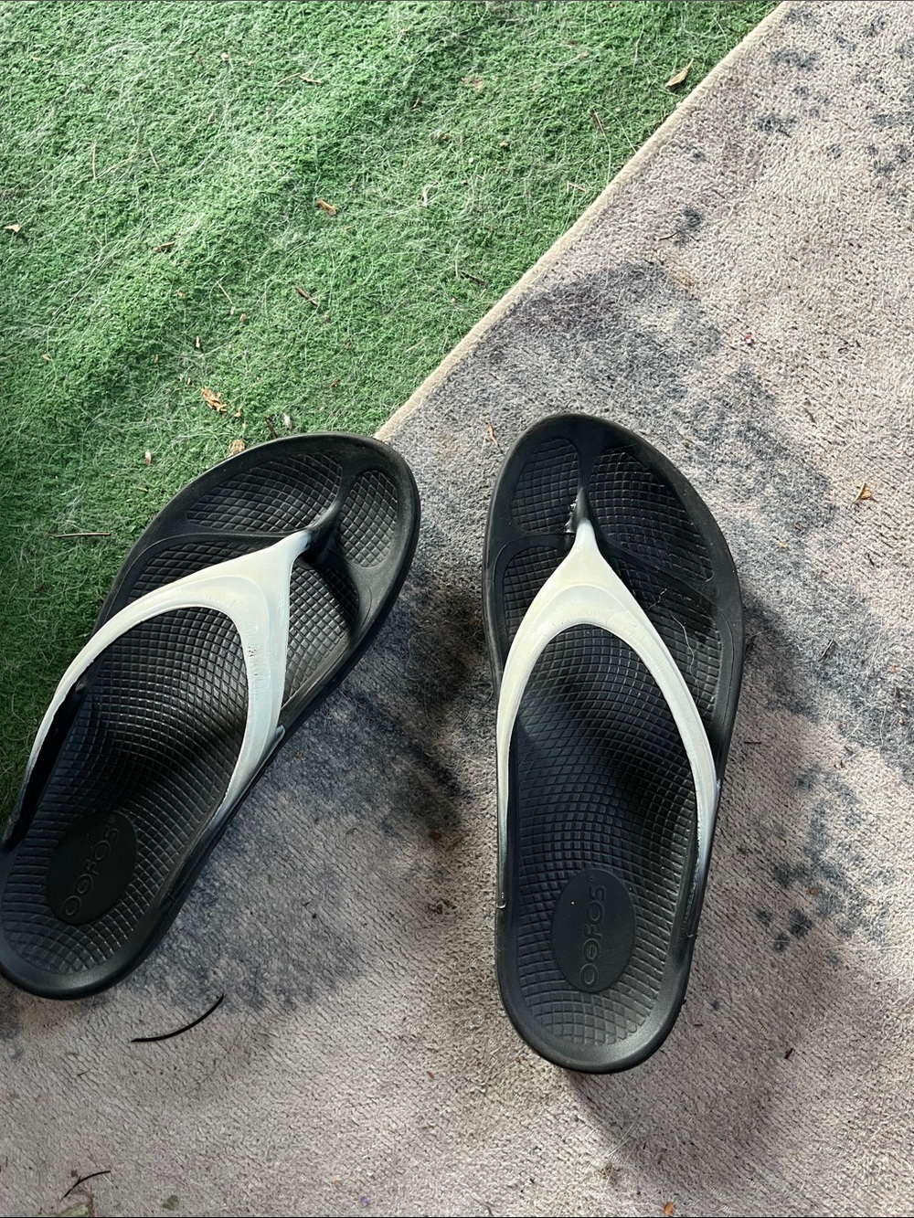 OOFOS Black and White Foam Flip Flops